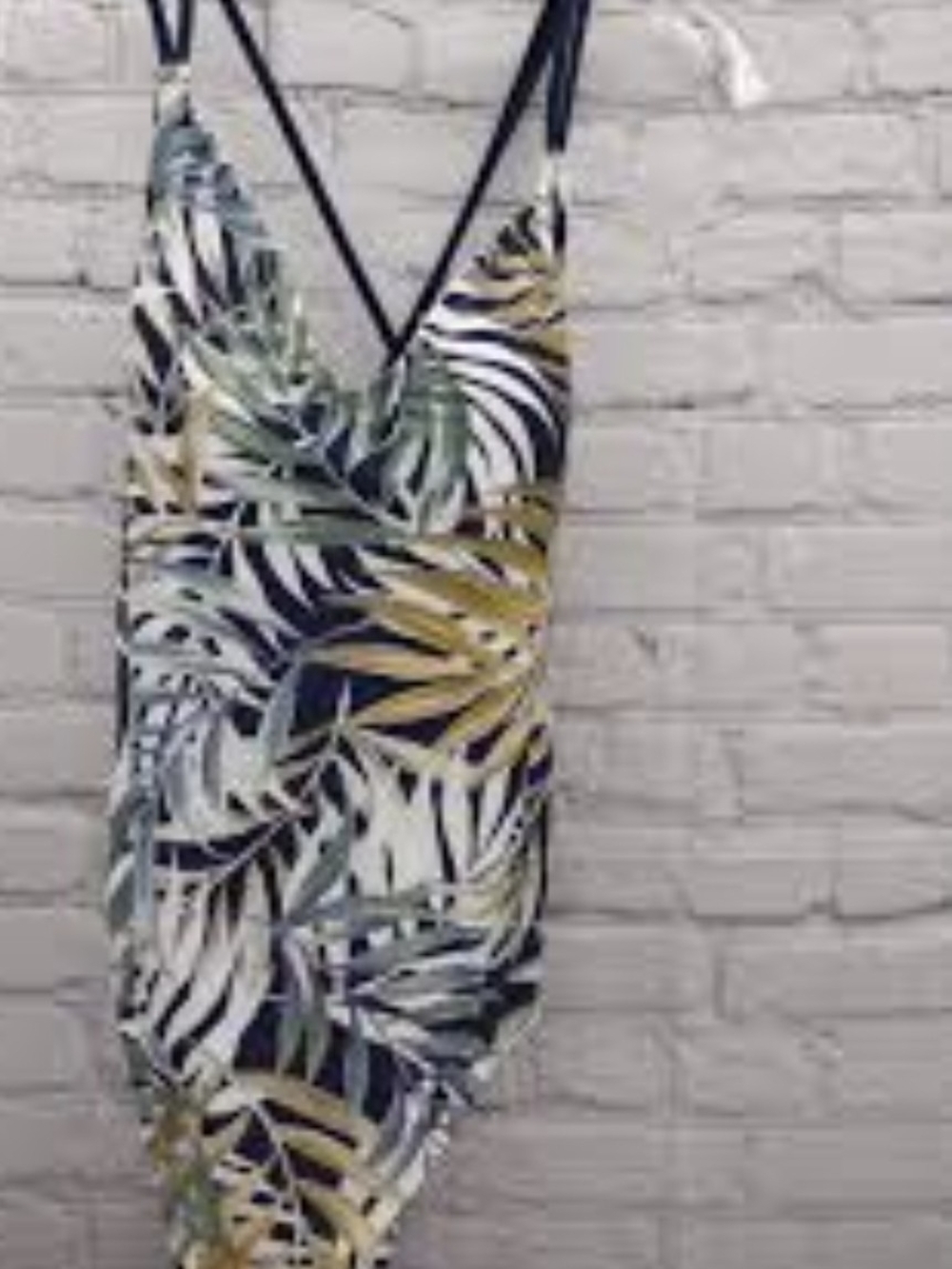 Hurley women's one-piece swimsuit featuring a tropical floral and palm leaf pri